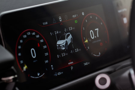 TPMS (Tyre Pressure Monitoring System) with temperature measurement monitoring. Modern digital car dashboard close up. Translation of "Bar"の写真素材