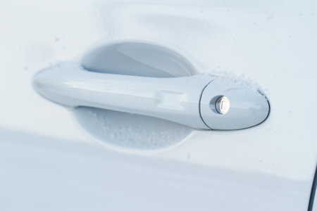 car door handle. Keyless entry car door handle with touch sensor. access button. modern white carの写真素材