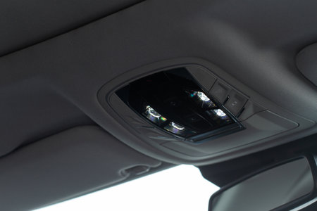Close up image of the SOS button and car ceiling lamp in a car.の写真素材