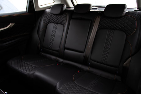 modern car interior. Clean rear seats with the belts. Three rear seats in the row. Leather back passenger seats.の写真素材