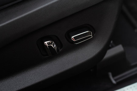 Electric car seat adjustment control panel close up view. Adjustable car seat position. Car interior.の写真素材