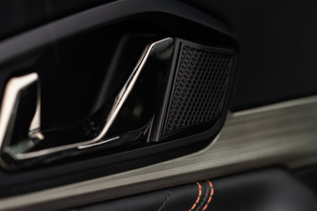 Car door handle closeup view. car interior door panel. Modern car door panel close-up view.の写真素材