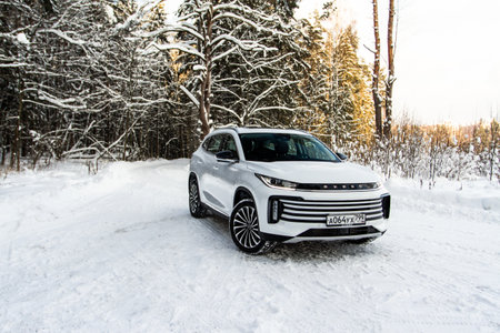 Moscow, Russia - December 25, 2021 Chery Exeed TXL car also called Vantas TX, midsize crossover car. Exterior front-side view. Exeed TXL model with all-wheel drive.のeditorial素材