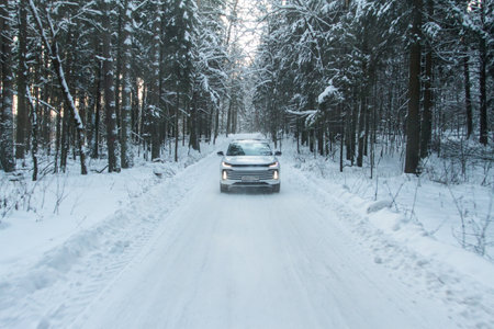 Moscow, Russia - December 25, 2021 Chery Exeed TXL car also called Vantas TX, midsize crossover car. Exterior front-side view on blurred winter background. Exeed car in motion.のeditorial素材