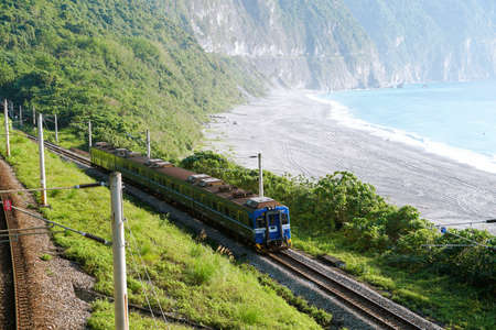 Train approaching the Chongde Bay(Xiulin) in Hualien, Taiwanの写真素材