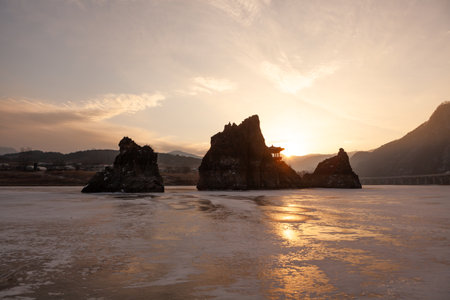 A small island with a pavilion, a river, a red-hot morning sunrise sceneの写真素材