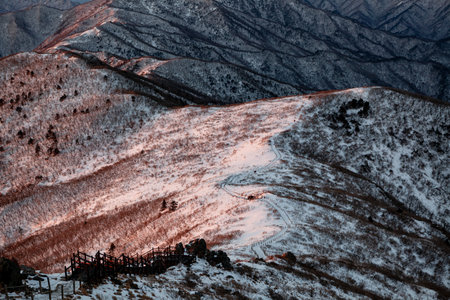 Mountains covered with snow at sunrise. Beautiful winter landscape in the mountains.の写真素材