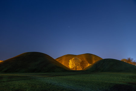 Moonrise over the hill in the park. Beautiful nature landscape.の写真素材