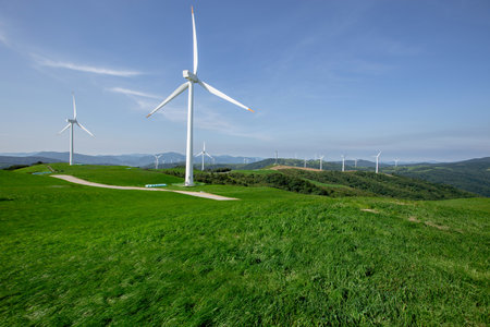 Wind farms spread out under the blue skyの写真素材