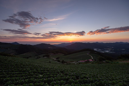 High mountains, highland fields, and sunrise scenes in the villageの写真素材
