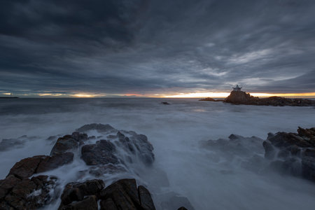 Sunrise with small hermitages on the beach, long exposure.の写真素材