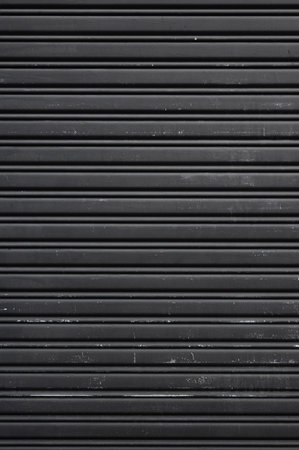 gray-painted shutter door pattern background. Metal shutter door pattern for background.の写真素材