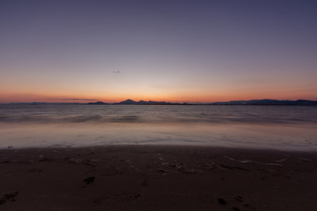 Sea full of dark sunset colors. Long exposureの写真素材