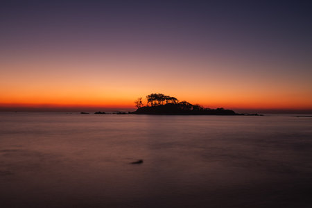 wood and island silhouettes and dark sunsetsの写真素材