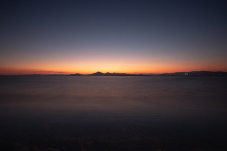 Magic hour. Long exposure to the sea with sunsetの写真素材