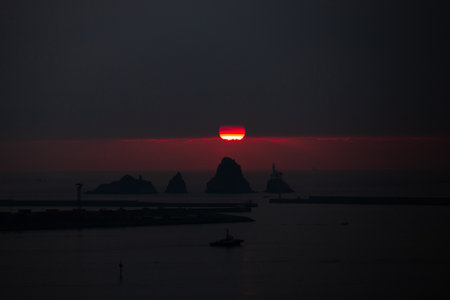 Sun rising behind the islands, the sunrise of the seaの写真素材