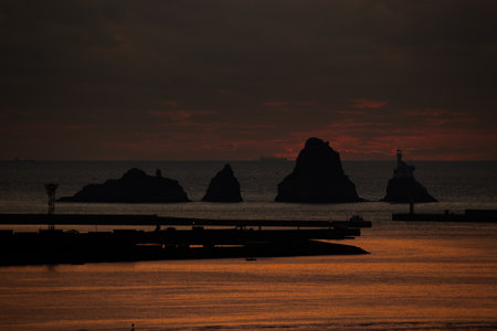a sea sunrise scene with islands side by sideの写真素材