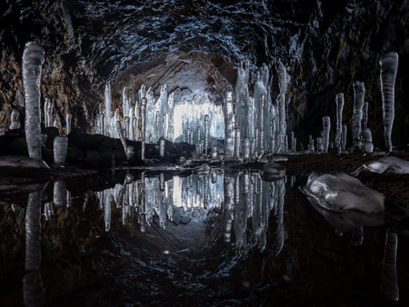 reflection of icicles created in dark cavesの写真素材