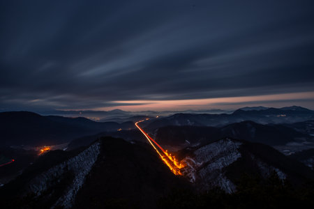 the highway between the mountains and the sceneryの写真素材