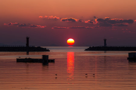 the sunrise of the sea in a fishing villageの写真素材