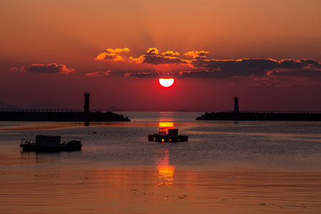 the sunrise of the sea in a fishing villageの写真素材