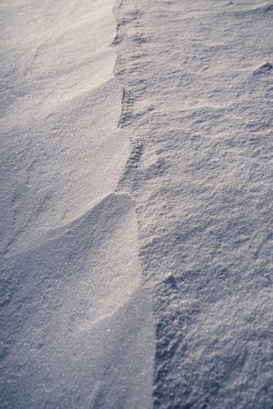 Patterns and textures created by snow and wind. Light and shadow.の写真素材