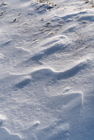 Patterns and textures created by snow and wind. Light and shadow.の写真素材