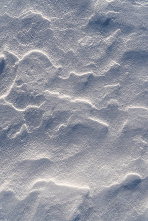 Patterns and textures created by snow and wind. Light and shadow.の写真素材