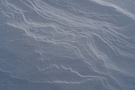 Patterns and textures created by snow and wind. Light and shadow.の写真素材