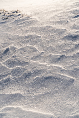 Patterns and textures created by snow and wind. Light and shadow.の写真素材