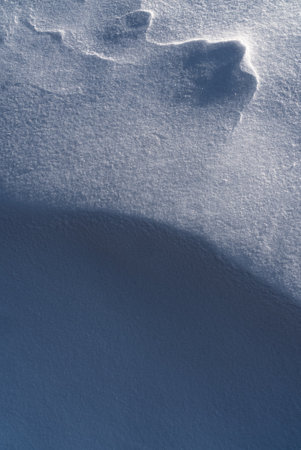 Patterns and textures created by snow and wind. Light and shadow.の写真素材