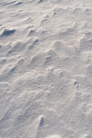 Patterns and textures created by snow and wind. Light and shadow.の写真素材