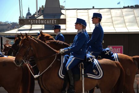 Sweden Stockholm street house trees horse people police guard trooperのeditorial素材