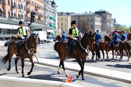 Sweden Stockholm street house trees horse people police guard trooperのeditorial素材