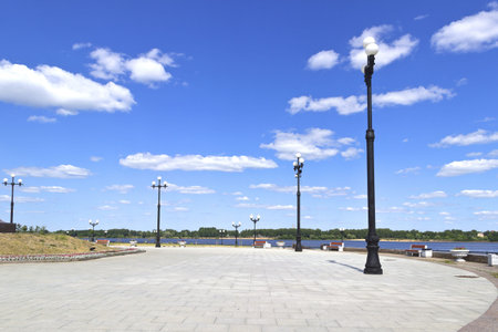 Lights on the square in the Park of Yaroslavl on the Volga river Bank sky clouds Sunny blue white...