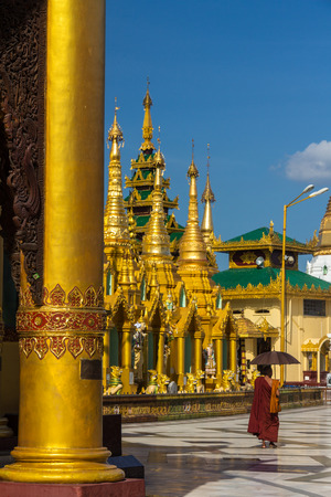 Monk in Shwe Dagon Pagoda in Burmaの写真素材
