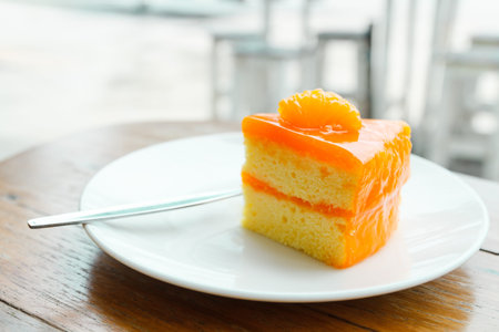 Orange cake on wood table