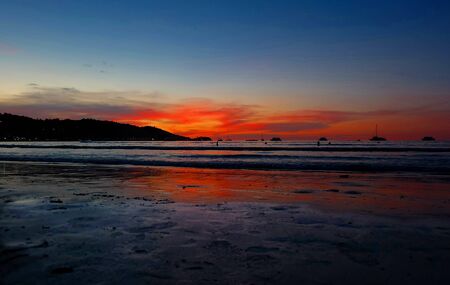 sunset on the beach in thailandの写真素材