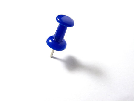Blue pin isolated on white backgroundの写真素材