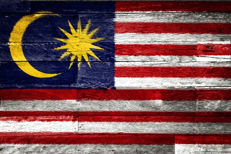 malaysia flag painted on old wood backgroundの写真素材