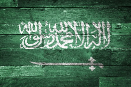 Saudi Arabia flag painted on old wood backgroundの写真素材