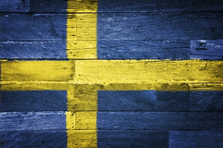 sweden flag painted on old wood backgroundの写真素材