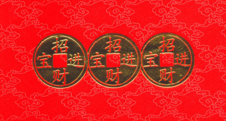 Chinese gold coin on red backgroundの写真素材