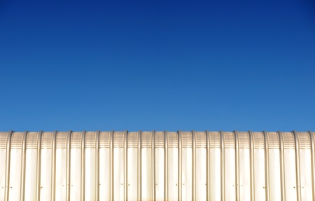 silver metal roof and blue sky backgroundの写真素材