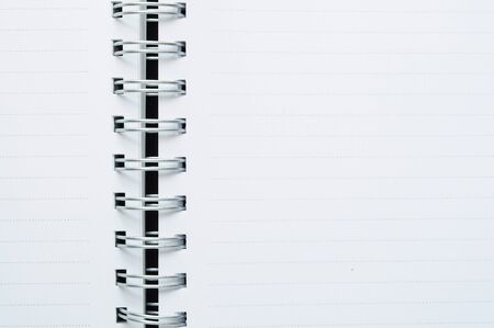 Close-Up of blank spiral dot line white note backgroundの写真素材