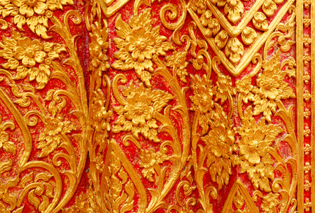 Detail of Thai pattern on temple pavilion wall backgroundの写真素材