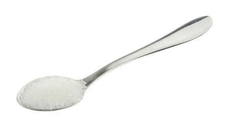 Spoonful of white sugar isolated on white backgroundの写真素材