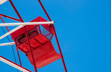 Red ferris wheel against a sky backgroundの写真素材