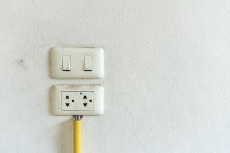 Old electric-switch on white backgroundの写真素材