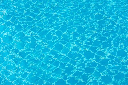Blue mosaic tiles of swimming pool water for backgroundの写真素材